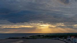 Solar harps through dark clouds over the Western Scheldt by SchumacherFotografie