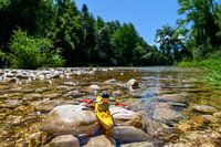 Lego puppet in natural landscape with canoe
