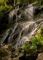 Waterfall with sunbeams