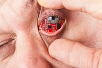 Man with a circuit board in his eye