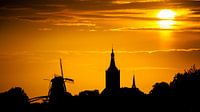Zonsondergang boven Hasselt van Karel Pops thumbnail