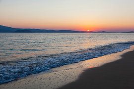 Sunset with calm sea on the beach of Naxos, Greece. by Eyesmile Photography