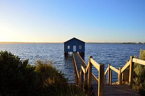 Blue boat house at sunrise