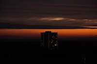 Zonsondergang bij een flat