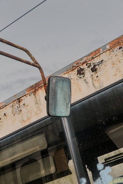 Reflection of Impermanence: Abandoned Tram with Weathered Mirror by Melvin Meijer