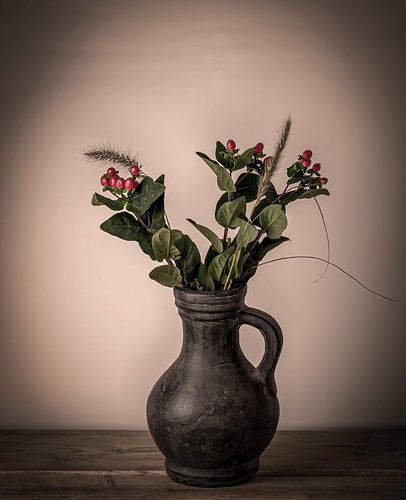 Vase with red berries