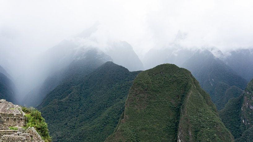Peru - The fog in the mountain peaks at Machu Picchu by Eline Willekens