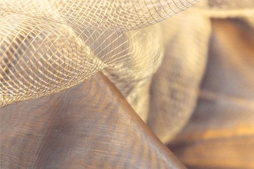 Lichte netstof in een warme beige kleur