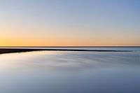 Orange sunset in an oasis of blue
