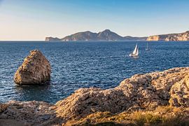 A sailing boat in the evening light off the coast of Port d'Andratx, Mallorca by Christian Müringer