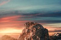 Sunset casts dramatic light on mountaintop