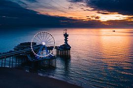 The pier of Scheveningen in the light of the sunset by Arthur Scheltes