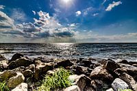 Rocks in the surf on the horizon on Urk Netherlands