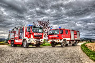 Twee generaties van een brandweerwagen van Hermann Kollinger