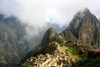 Machu Picchu at sunrise in the fog
