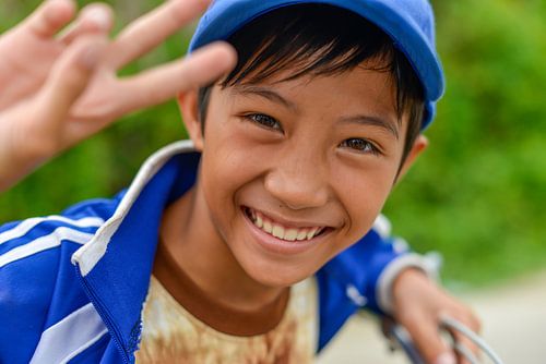 Cheerful Vietnamese boy by Richard van der Woude
