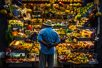 Man at a summer fruit market