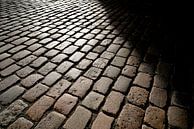 Cobblestones of a street in the old town by Heiko Kueverling thumbnail