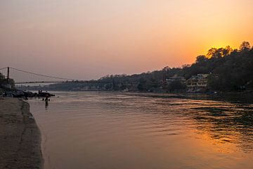 The holy river Ganges near Laxmanjhula in India Asia with sunset by Eye on You
