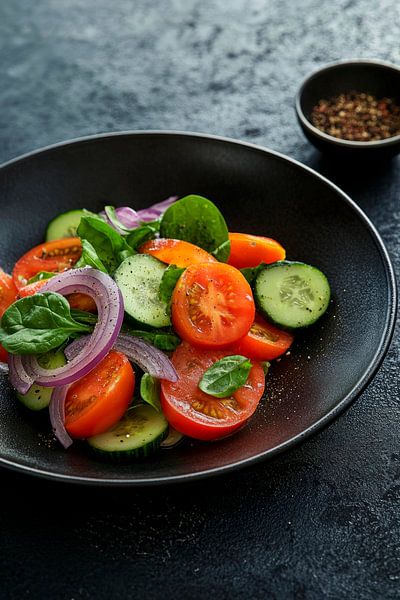 Fresh vegetable salad in a black plate by Poster Art Shop