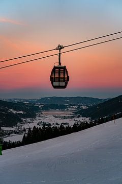 Sunset over the Hörnlebahn with a view of the Alpsee lake by Leo Schindzielorz