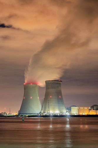 Landscape with embankment and nuclear reactor Doel at night