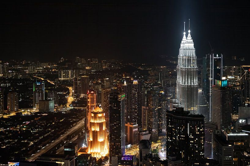 Kuala Lumpur with the Petronas Twin Towers at night. by Adri Vollenhouw