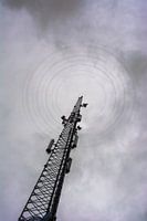 Dark weather over mobile phone mast