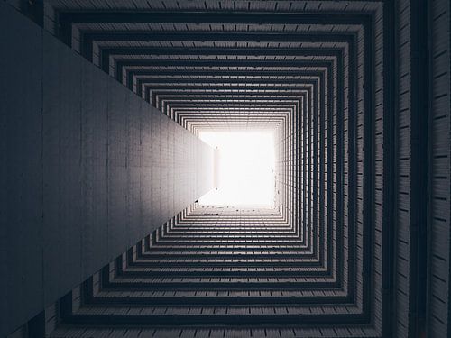 Looking straight up at the courtyard of an apartment building in Kowloon, Hong Kong