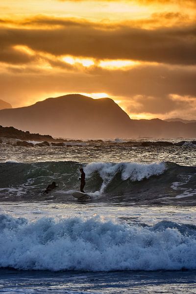 Surfers during sunset on Alnes, Godøy, Norway by qtx