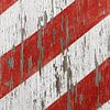 Weathered red and white striped old boards by Shot it fotografie