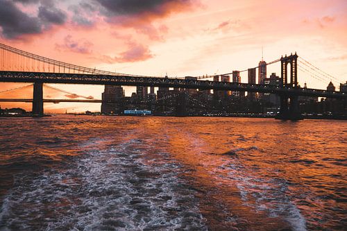 Spectacular red orange sunset over Brooklyn Bridge, New York