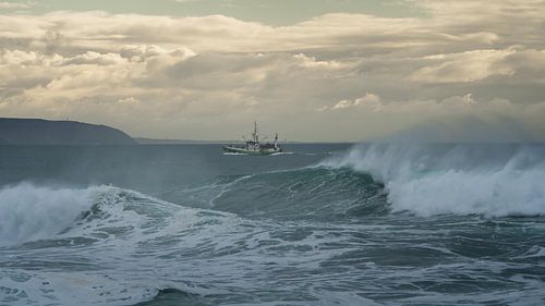 Fishing boat on stormy seas