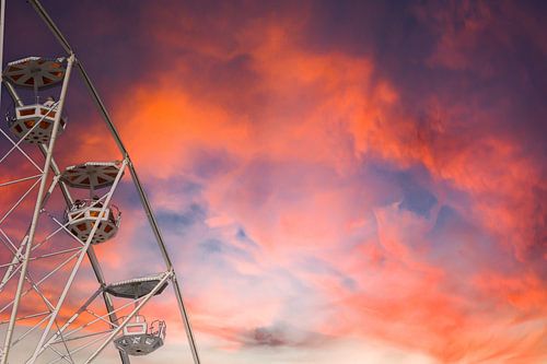 Gondolas of a Ferris Wheel in the Sunset