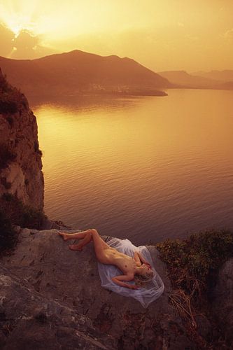 Nude in the evening sun by the sea
