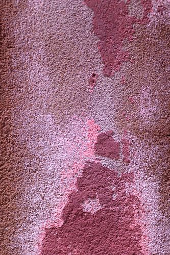 Abstracte fotografie: paars-roze muur met veel textuur