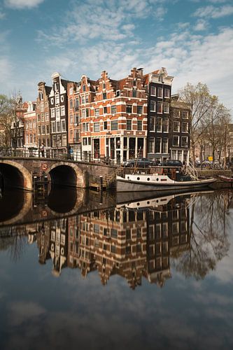 Canal and old houses in Amsterdam, the Netherlands. by Lorena Cirstea