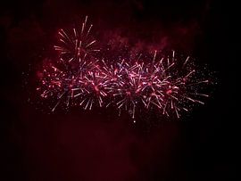 Red / purple fireworks during Divali / Old & New by Monrey
