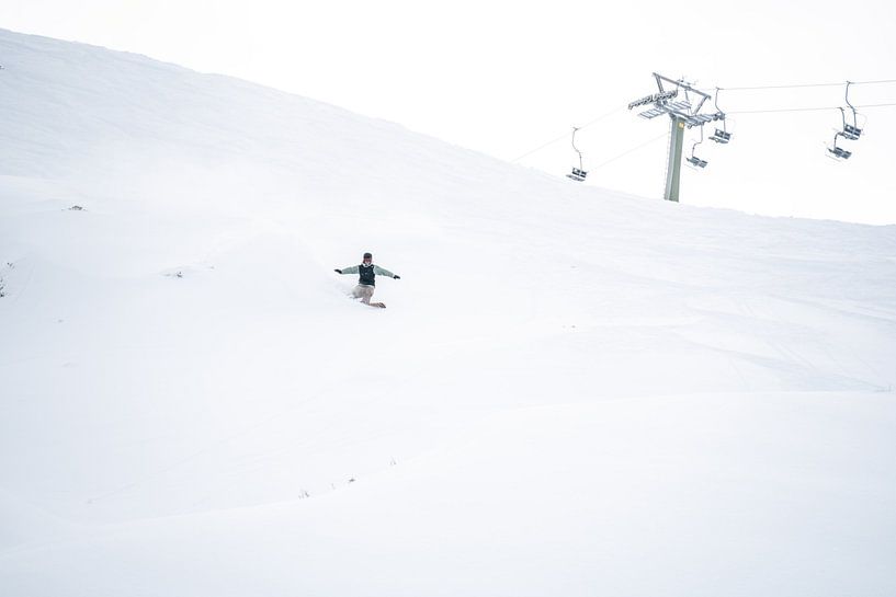 Freeriding powder snow riding in Montafon, Vorarlberg Snowboard group by Leo Schindzielorz