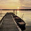 Panorama jetty with rusty rowing boat at sunset by Frank Herrmann