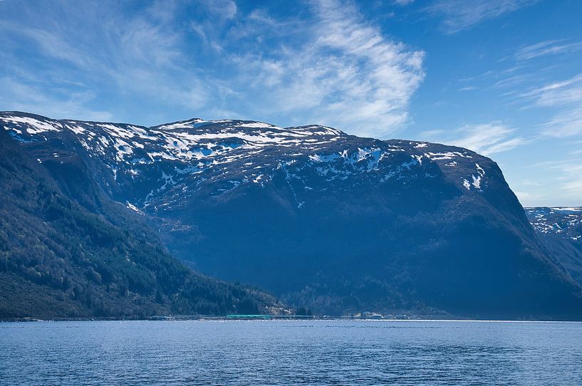 Western Cape in Norway. Fjord and sea with clouds and mountains on the coast by Martin Köbsch
