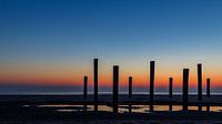 Palendorp in Petten met zonsondergang van Karin Bijpost thumbnail