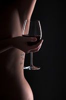 Woman body lines with a glas of wine