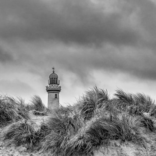 Lighthouse in dune grass in black and white