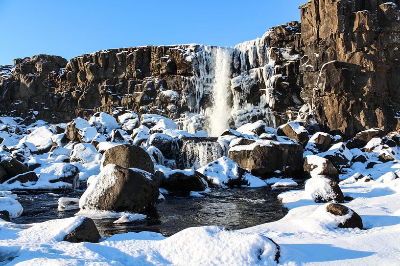 Winter waterfall in Iceland by Mickéle Godderis