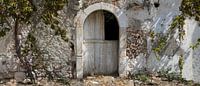 Old facade with dilapidated door
