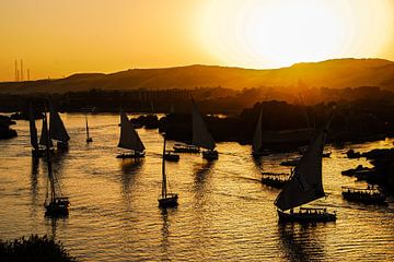 Felucca on the Nile near Aswan Egypt at sunset by Dieter Walther