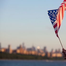 American flag waves above the Hudson River on 4th of July, Manhattan, New York City, America by WorldWidePhotoWeb