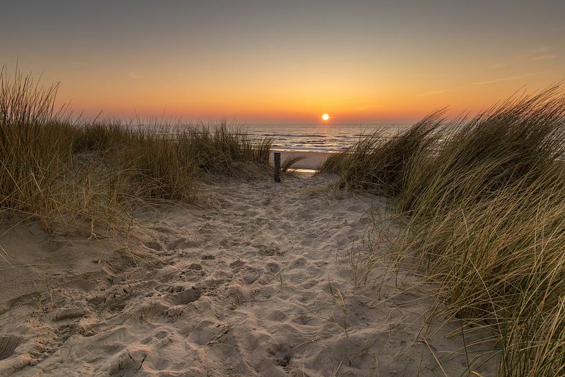 View from the dunes near Petten of the setting sun over the North Sea by Bram Lubbers