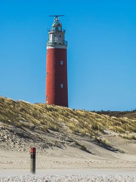 The Beach Pole And The Lighthouse by Martijn Wit